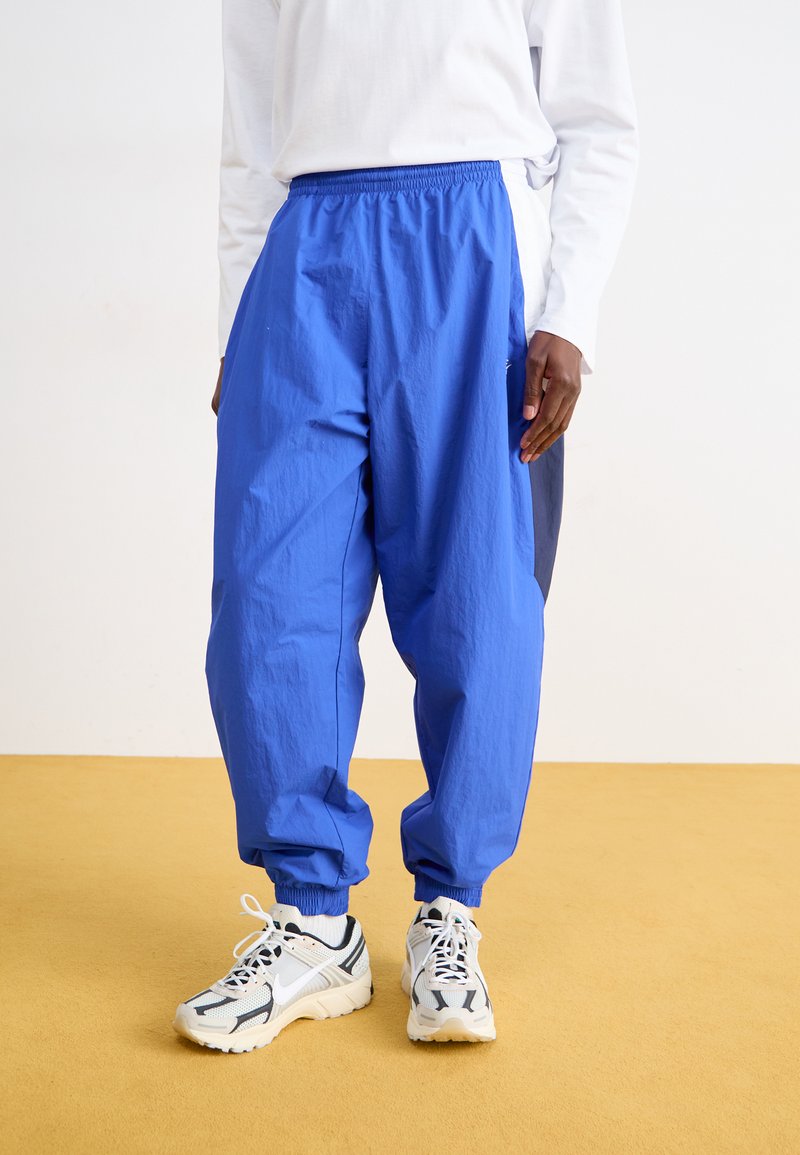 Nike Sportswear CLUB PANT - Pantalon de survêtement